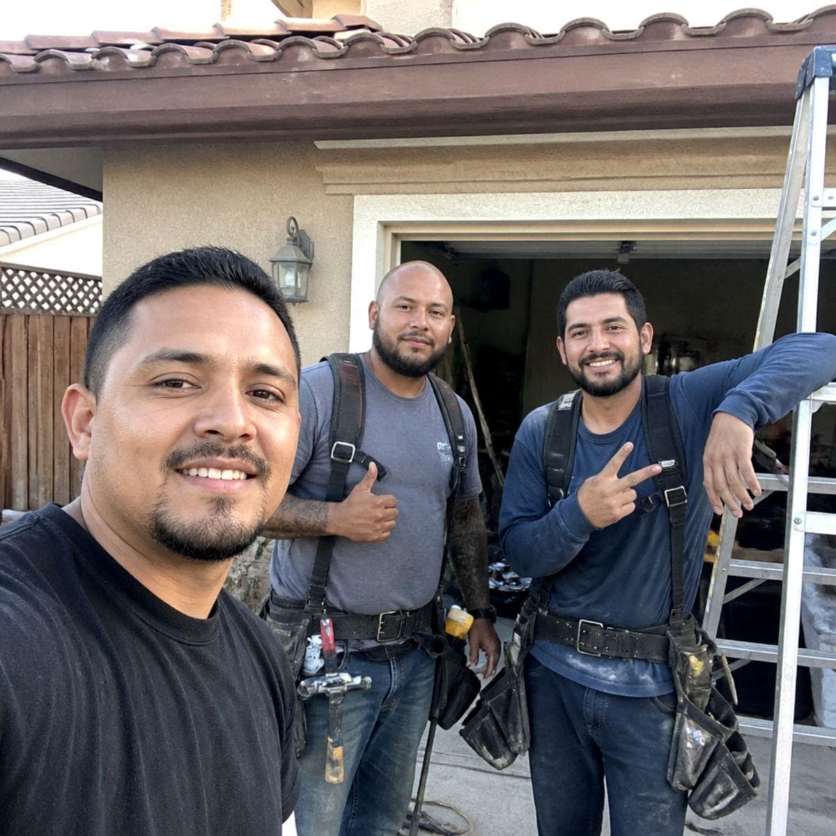 HVAC technician shaking hands with a homeowner at her front door