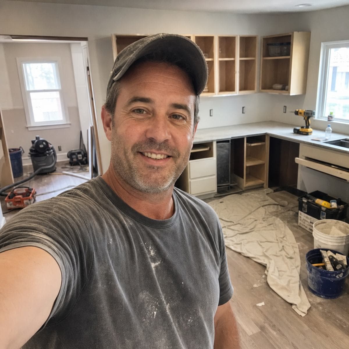 Contractor shaking hands with homeowners on their porch